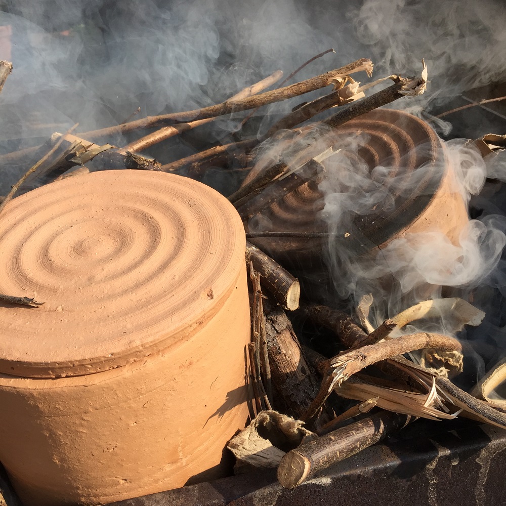 sagger made from brick clay on a fire protecting pottery by herefordshire artist jon williams