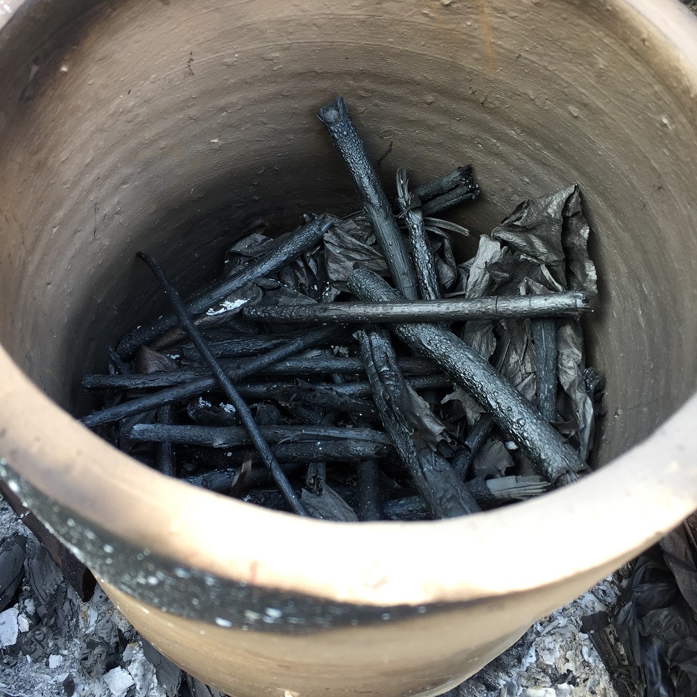 sticks of charcoal inside a sagger created by herefordshire potter jon williams