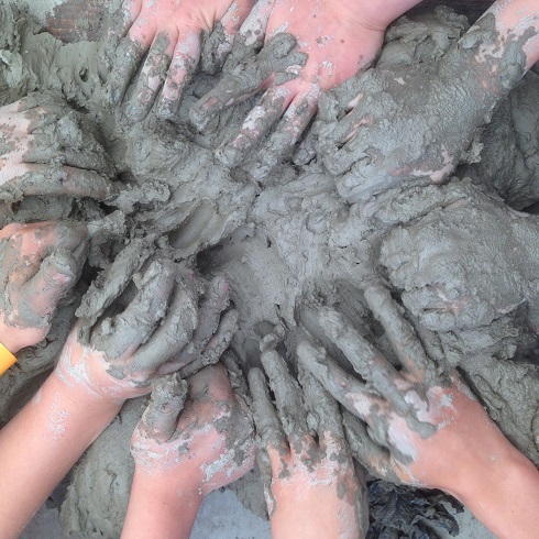 children's hands in squidgy clay
