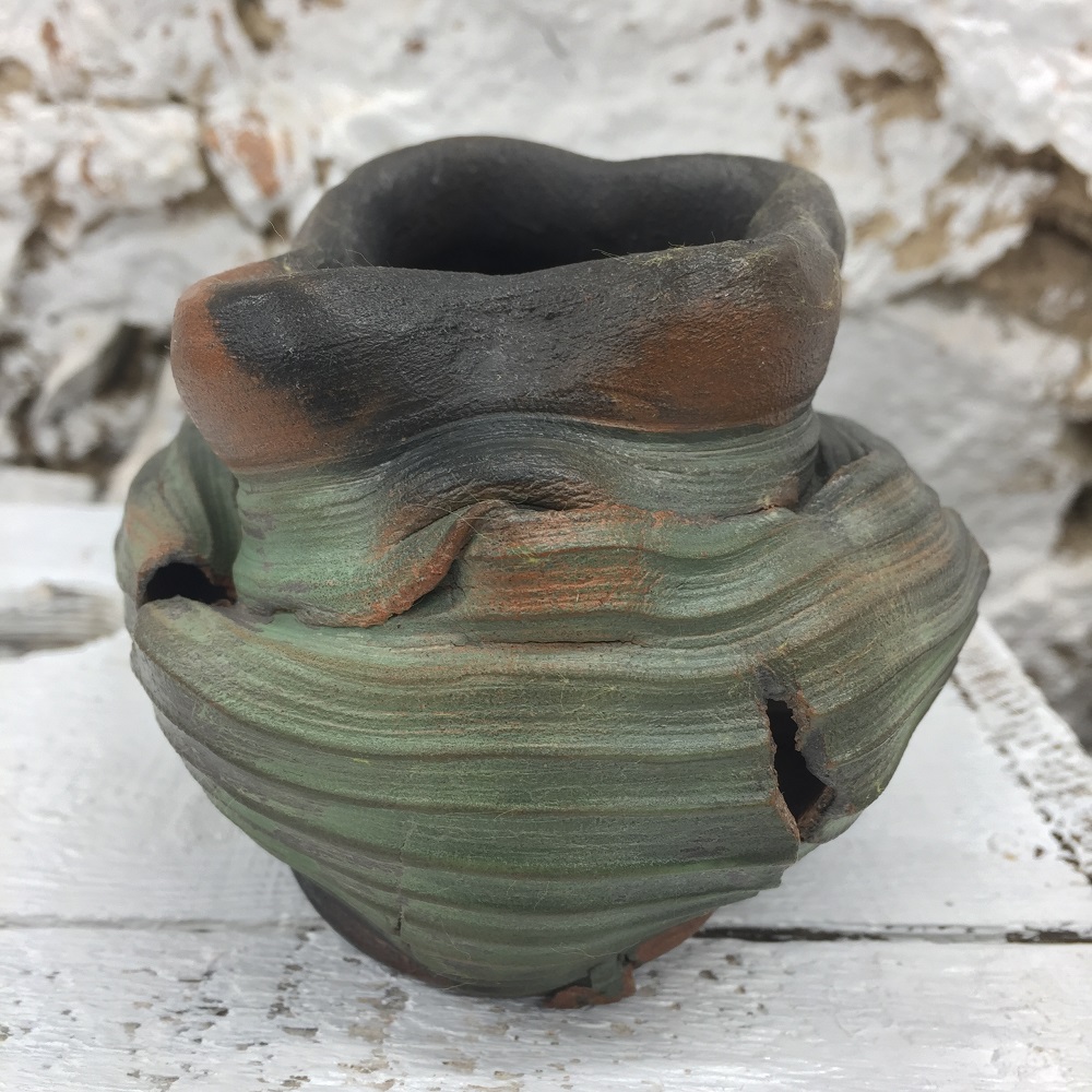thrown torn and altered pot made on the potter's wheel by ceramic artist jon williams