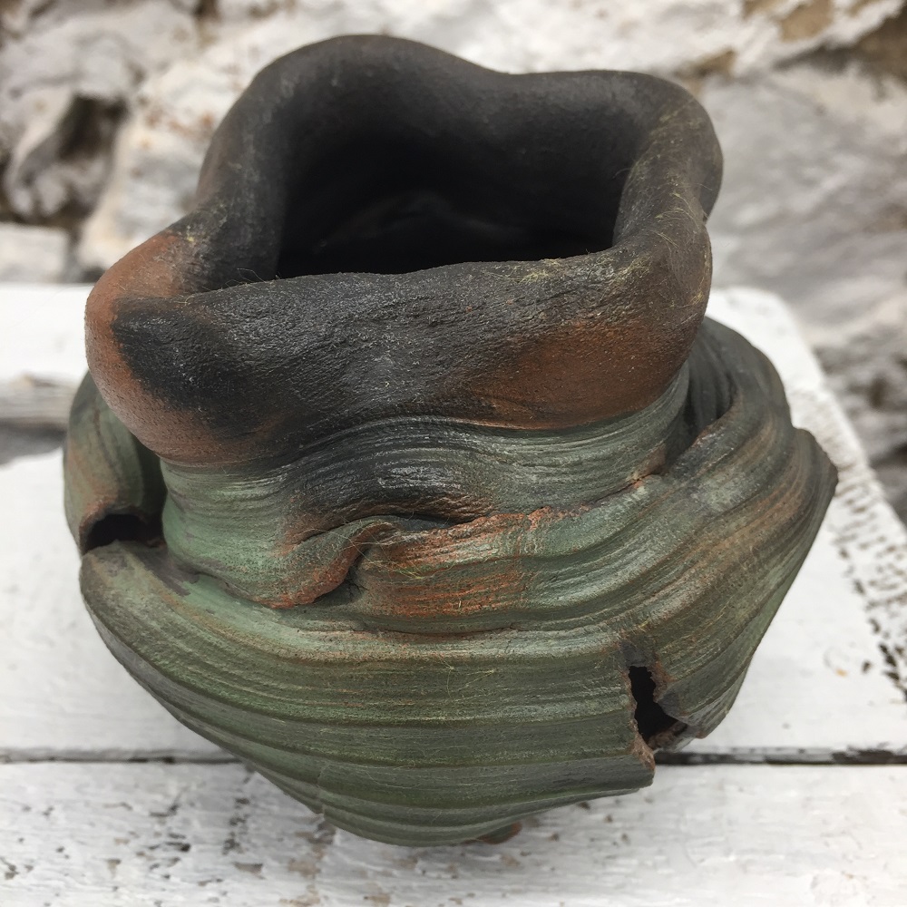 thrown torn and altered pot made on the potter's wheel by ceramic artist jon williams