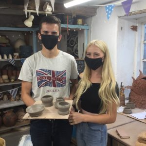 masked pottery class participants at eastnor pottery herefordshire