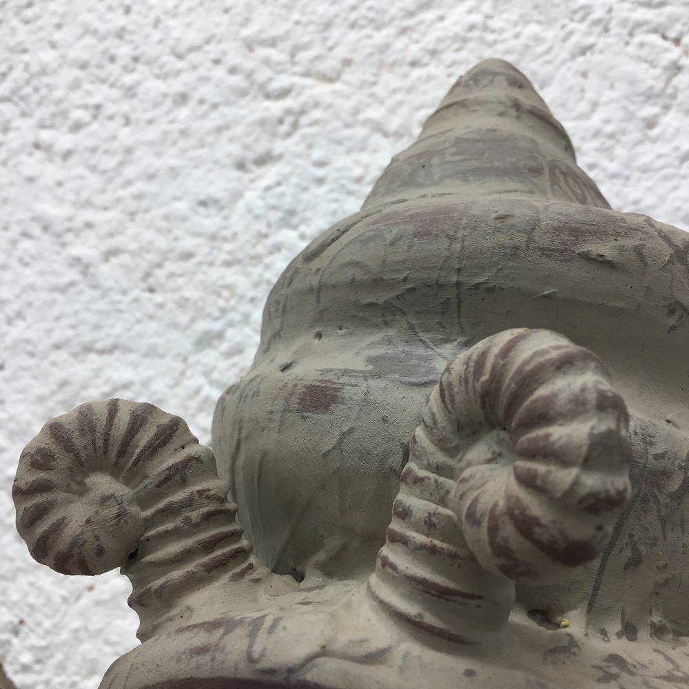 details of rocking snail sculpture by herefordshire artist potter jon williams