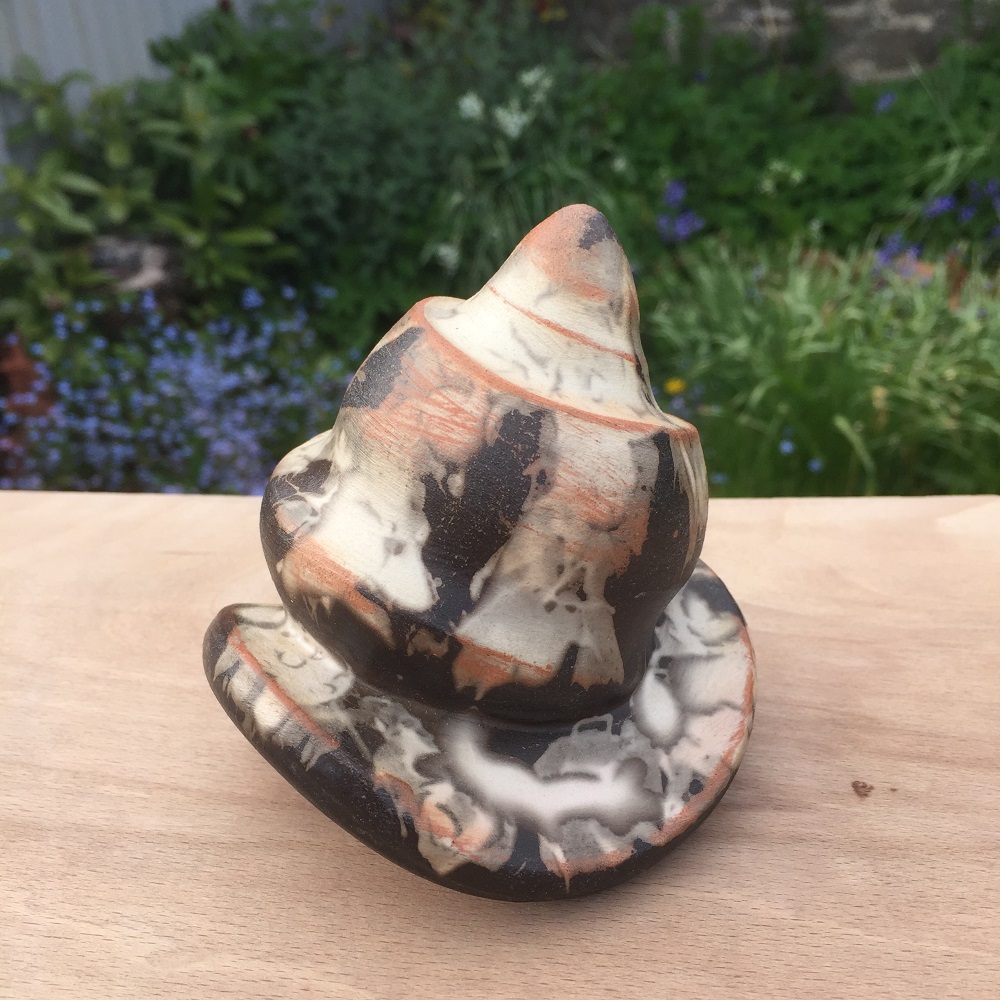 smoke fired rocking snail by ceramic artist jon williams
