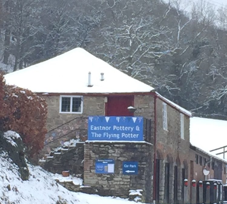 a snowy approach road to eastnor pottery the artist studio of jon williams
