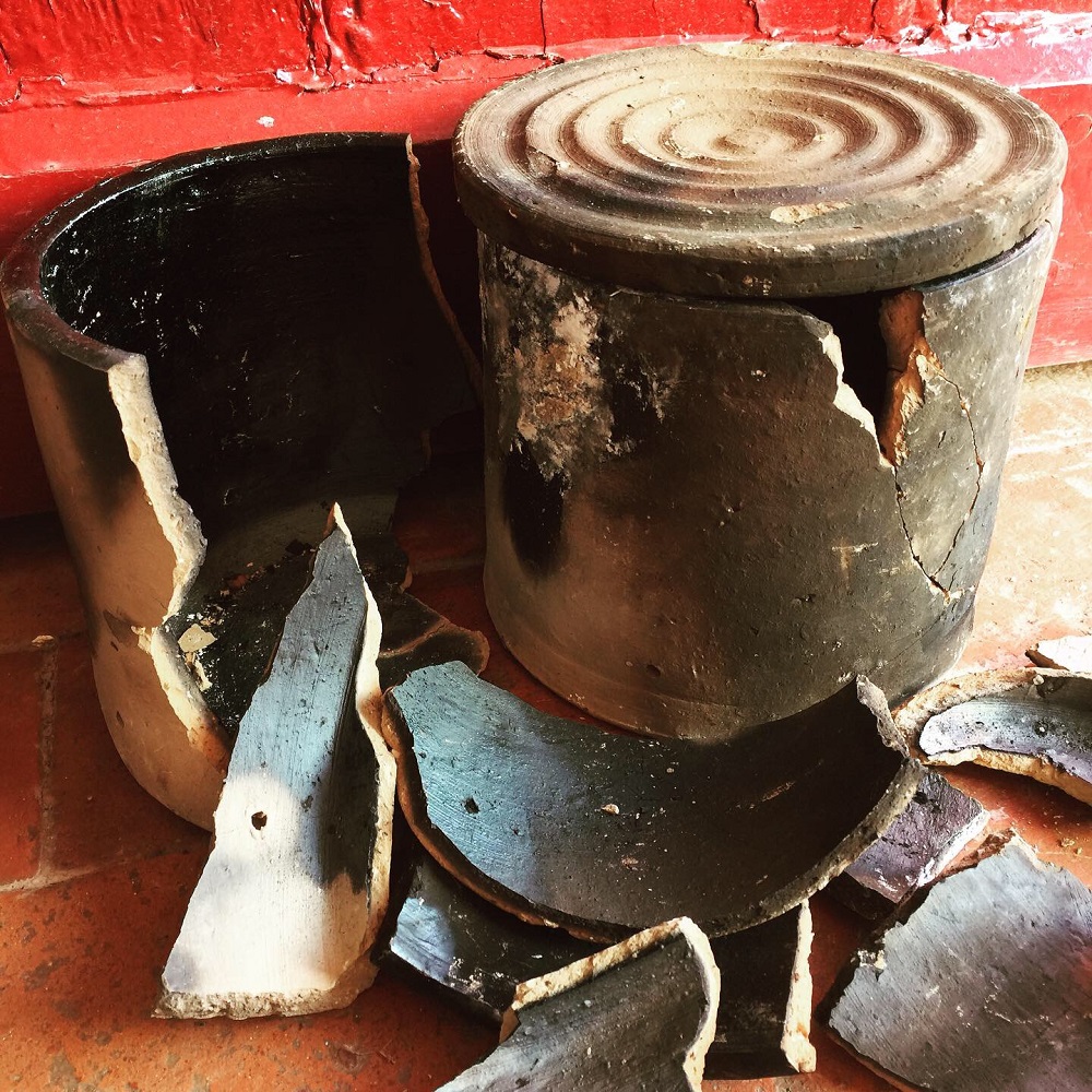 broken saggers used in the fire place by potter jon williams to decorate his pots with smoke